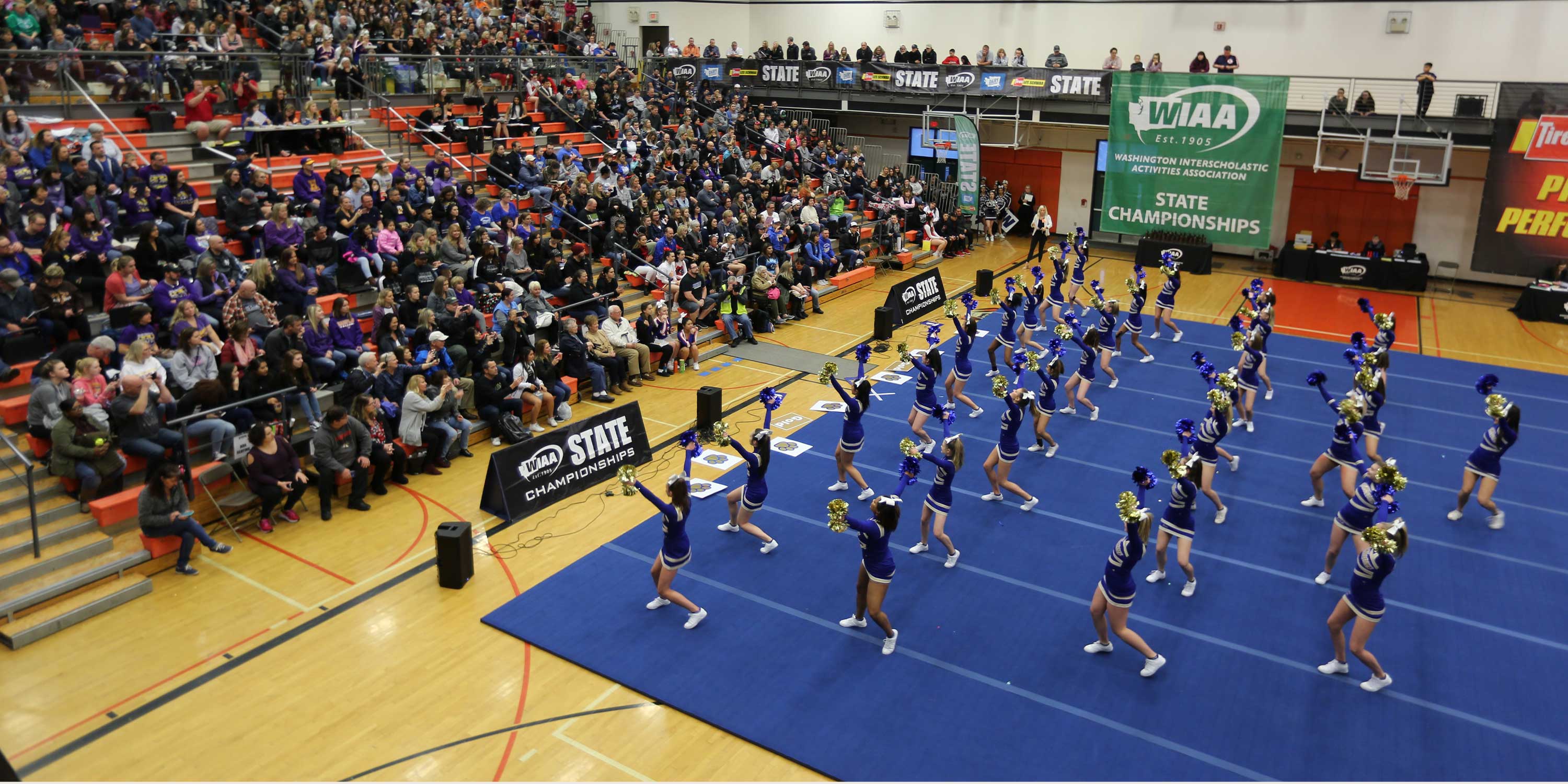 A cheer team demonstrates excellence.